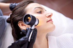 Skin specialist consulting with a patient and evaluating skin condition before recommending a personalized treatment plan.