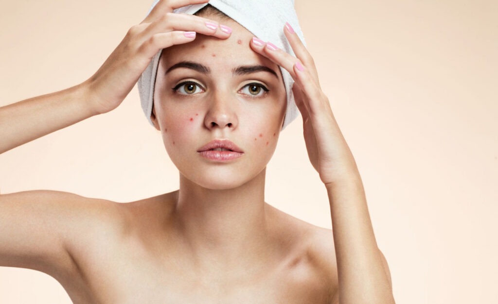Skin specialist examining a patient's skin condition during professional consultation